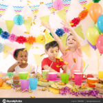 Cute little children celebrating birthday at party